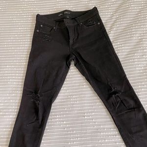 Black distressed skinny jeans, ankle length